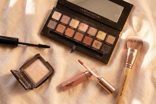 makeup trends 2026 β neutral eyeshadow palette lipstick brush flat lay